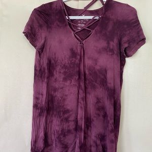 Maroon t-shirt with cross cross detailing on front